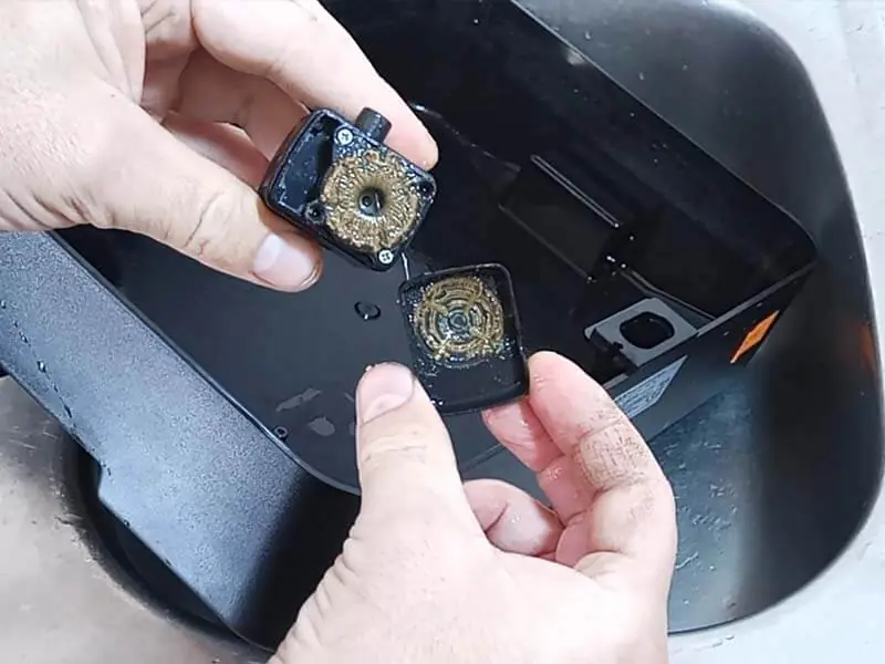 Dirt and mineral deposits on the pump